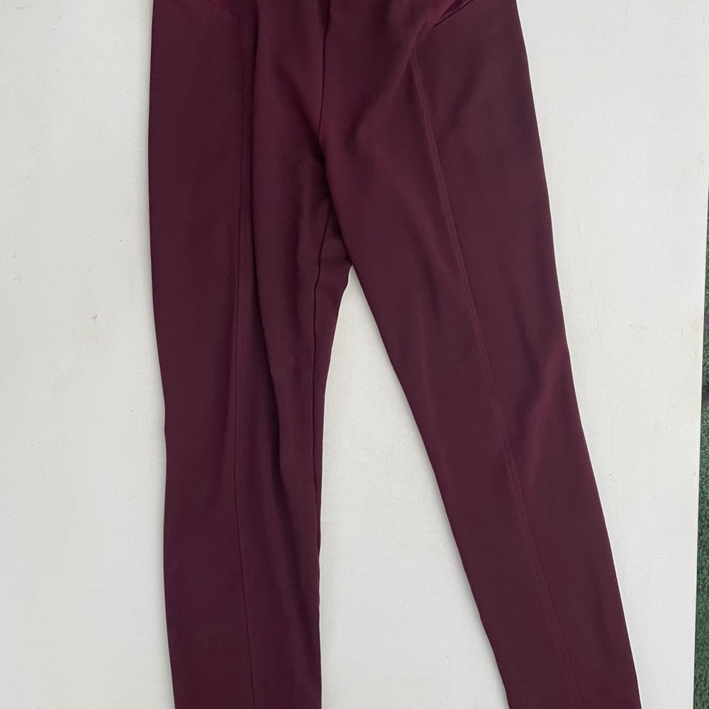 Jennifer Lopez winter leggings.  Color maroon.